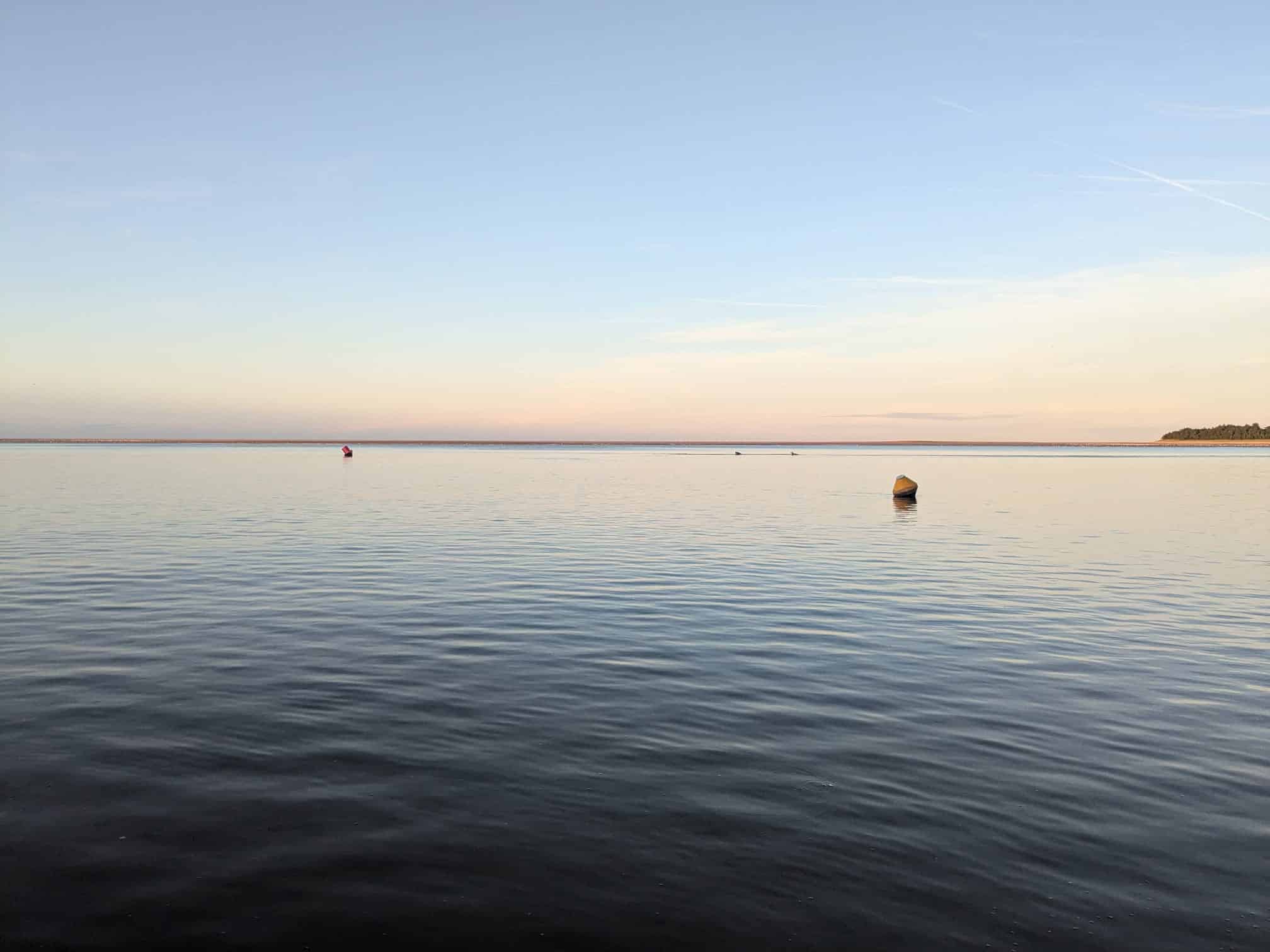 A still sea at dusk in Wells-next-the-Sea, taken from in the water