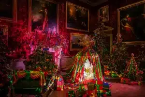 A state room decorated for Christmas in bright ribbons