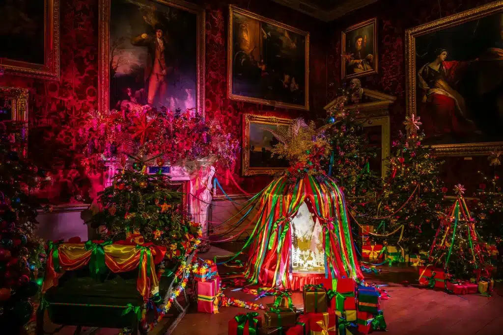 A state room decorated for Christmas in bright ribbons