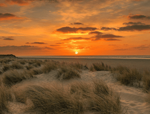 Sunset over a sandy beach
